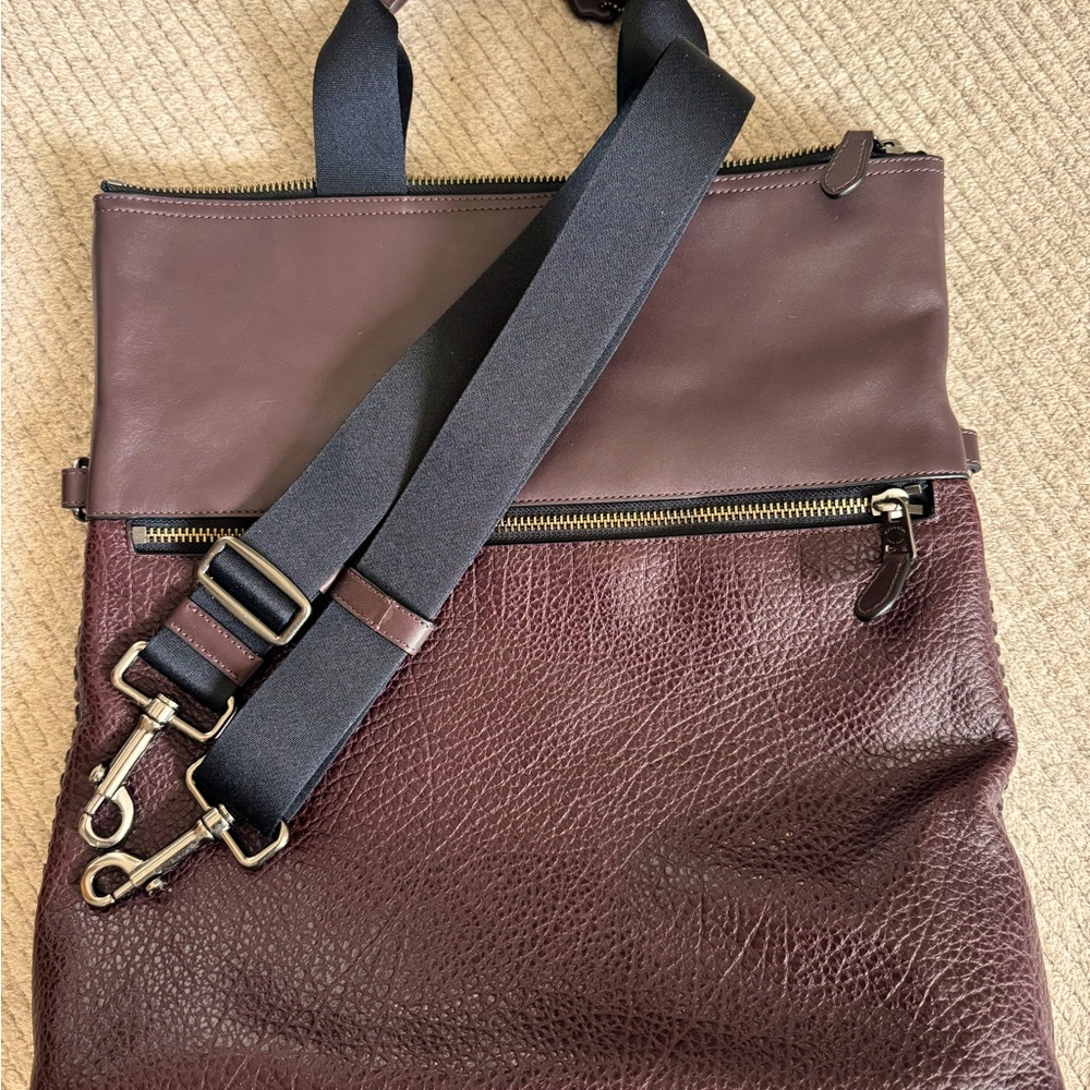 Coach soft side briefcase/computer bag. Never been used. Deep merlot. 15”x15”